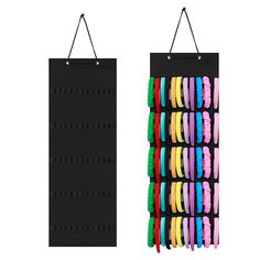 two black pegboards with different colored bracelets hanging from the hooks on each side