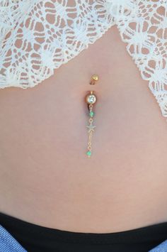 "A star belly button ring to complete your holiday look with a delicate touch of sparkly style! This navel piercing is handmade of a 14k Gold filled barbell, star pendant, and light blue Swarovski crystal beads. Do not hesitate to contact me for special requests and customization! ♥♥ ▶ 14K goldfilled curved barbell, 11 mm long for a universal fit. ▶ Delicate 14K goldfilled chain ▶ Light blue Swarovski faceted crystal beads ▶14K goldfilled Star charm ▶ Dangling pendant measures 4 cm (1.57 inches) Jewelry Star, Navel Piercing, Belly Piercing, Belly Button Piercing, Swarovski Crystal Beads, Button Ring