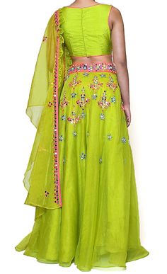 The party's here! This gorgeous designer lehenga features a green organza base with multi-color threadwork throughout along with stunning mirror work. t is paired with a matching short blouse in dupion base and a dupatta. Designer: Preeti S Kapoor