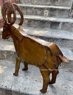 an animal statue sitting on top of some steps