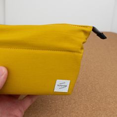 The Kokuyo N-Storage features a zipper closure that when open, rolls back allowing you to see all of its contents. Each pocket is at a diagonal keeping things easy to find and accesible. This pencil case has a medium holding capacity. The interior of the pencil case has a square deep pocket which can hold up to 13 pens. There is a shallow diagonal pocket perfect for holding an eraser, correction tape, or other small tool. Then finally there is a deep long rectangular pocket, perfect for holding Travel Zipper Pencil Case In Rectangular Shape, Travel Zipper Pouch Pencil Case, Travel Pencil Zipper Pouch Stationery, Travel Zipper Pouch Stationery, Multifunctional Stationery With Pen Slots, Rectangular Travel Pencil Case With Pen Holders, Everyday Rectangular Pencil Case With Zipper Pocket, Foldable Rectangular Pencil Case For Travel, Travel Zipper Pencil Case