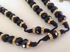 "Hecho con crystal Importado negro de 10mm x 8mm sobre Hilo de pulsera negro, practica mente inrompible, Los crystales son importados de Republica Checa y mezclados con rhondelles bañados en Oro con brillantes de crystal alrededor. La Cruz Es de metal pintada en negro hecha en Italia mide 1\" pulgada de alto y tiene el simbolo de La Cruz De San Benito , protector contra el diablo, la muerte y exorcismos. Perfecto para llevarse be el cuello muy a la moda, Es todo en negro. El aro del Rosario mide Adjustable Black Rosary With 8mm Beads, Adjustable Black Spiritual Rosary, Black Rosary Necklace, Black Rosary, Chicanas Tattoo, Rosary Necklace, Rosary, Hand Made, Beaded Bracelets