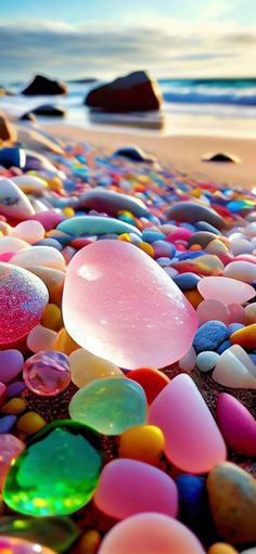 many different colored rocks on the beach