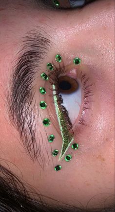 Rhinestone Eye Design, Rave Face Gems, Green Makeup With Gems, Graphic Liner With Rhinestones, Green Rhinestone Makeup, Face Gem Ideas, Gem Makeup Looks, Rhinestone Eye Makeup, Tinkerbell Makeup