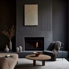 a living room filled with furniture and a fire place next to a wall mounted fireplace