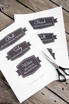 scissors are sitting on top of some white paper with black and gray labels that read best hair stylist