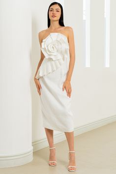 Strut your style in our strapless linen midi dress! This chic piece features a pencil skirt and beautiful rose details on the bodice. LENGTH: Top of shoulder to hem 37" FABRICATION: 100% LINEN STYLE#. DR-21279 WHITE - S24 *Dry Clean or wash on cold and hang flat to dry *Model is wearing size XS Spring Linen Cocktail Dress, Spring Cocktail Linen Dress, Spring Party Dress In Linen, Spring Party Linen Dress, Strapless Linen Dress For Spring, Chic Spring Dresses With Rose Detail, Linen Midi Dress For Wedding, Fitted Linen Midi Dress For Party, Elegant Strapless Dress For Spring Brunch