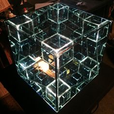 an illuminated cube sitting on top of a table