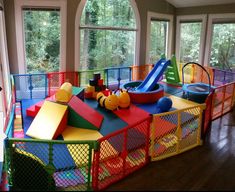 a child's play area with toys and slides