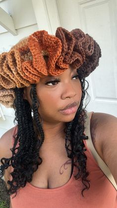 a close up of a person wearing a crochet hat