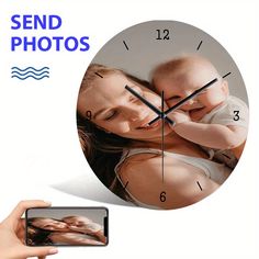 a person holding a baby in front of a clock with the words send photos on it