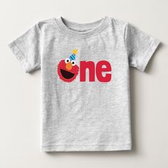 a gray shirt with the word one on it and an elmo bird wearing a birthday hat