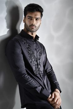 Black cotton shirt with black cutdana hand embroidered eagle.
Components: 1
Pattern: Hand embroidered
Type Of Work: Cutdana
Neckline: Collar
Sleeve Type: Full
Fabric: Cotton
Color: Black
Other Details: 
Note : Pant worn by the model is not for sale.
Occasion: Party - Aza Fashions Men Shirts Casual, Indian Groom, Eagle Shirts, Cotton Shirts For Men, Fashion Suits For Men, Fashion Suits, Shirts Black, Men Shirts, Groom Outfit