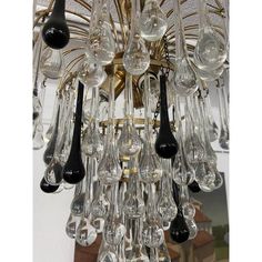 a chandelier with many glass drops hanging from it