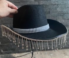 Top off your look with our ladies' cowboy hat with attached and dangly sequins. Perfect for festivals, western-themed parties, hen nights, and more! Each hat is made from a high-quality polyester blend and comes with an adjustable cord. Party decor for gatherings and celebrations.  Delivery from a small business in the United Kingdom. 💖 Size details: The cowboy hats measures approx 38 x 30 x 13 cm (14.96 x 11.81 x 5.11 inches) with an adjustable elastic rope, which can fix the hat on the head. Western Black Costume Hats And Headpieces For Party, Western Style Halloween Costume Hats And Headpieces, Western Party Hat With Rhinestone Fringe, Western Silver Hats For Parties, Western Style Silver Hats For Party, Western Adjustable Costume Hats For Parties, Fitted Western Party Hats, Western Style Hat Bands For Summer Parties, Adjustable Country Style Hat Bands For Party