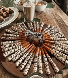 there is a plate with zebra cookies on it