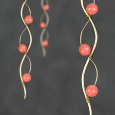 "The wiring earrings are handmade using 14k gold filled wire and pink coral. Free US shipping. Perfect gift for any occasions. Linear long earrings draws attention along vertical lines, visually elongating the face length, increase your height. In art, serpentine line is called\"The Line of Beauty\". S curves modulate from one gradient to another. S curves signify liveliness and activity and excite the attention of the viewer. This design is inspired by Rococo style, which is elegant, playful an Elegant Nickel-free Copper Wire Wrap Earrings, Elegant Rose Gold Earrings With Copper Wire, Pink Wire Wrapped Copper Jewelry, Pink Wire Wrapped 14k Gold-filled Jewelry, Handmade Pink Copper Wire Jewelry, Handmade Rose Gold 14k Gold-filled Earrings, Handmade 14k Rose Gold-filled Earrings, Adjustable Wire Wrapped Rose Gold Earrings, Pink Copper Wire Wrapped Jewelry