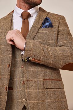 Inspired by old age country wear, the DX7 suit remains an ever so popular style. Reminiscent of the 18th century, it is ideal for Autumn/Winter with its earthy colour palette and heavy fabric. A touch of modernism is added with a velvet contrast collar, elbow pads and pocket trims, nudging it back into the 21st century. Check our more of Jonny's looks here. Features Herringbone Slim fit Single-breasted Notch lapel Double back vent Four button cuff Double button blazer fastening Complimentary nav Bespoke Tailored Suits For Fall, Bespoke Tailored Fall Suits, Winter Fitted Three-piece Suit For Formal Occasions, Classic Brown Three-piece Suit With Long Sleeve, Brown Three-piece Suit With Suit Collar For Fall, Brown Three-piece Suit For Fall With Suit Collar, Brown Fitted Three-piece Suit For Winter, Classic Brown Three-piece Suit, Bespoke Fall Suits