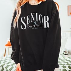 "Custom Senior Dancer Crewneck, Personalized Est Year Dance Senior Gear, Competitive Senior Dancer Gift, Unisex Comfort Colors Sweatshirt How To Order - Please make sure you have looked at all sizes and color charts. - Select from the various T-shirt sizes and colors from scroll-down menus. - Fill in the personalization box (if provided) as exemplified. - Click \"Add to cart\" button. You can turn back and add more items of different size and color. Order Process - Our processing time is 5-10 days. - Standard Shipping, 2-5 business days (after processing time). Product This custom crewneck sweatshirt brings both incredible quality and amazing style to the mix. Made with soft, ring-spun cotton fabric with 100% cotton threads, it sits unmatched when it comes to softness. All sweatshirts feat Pre-shrunk Crew Neck Top For Dance, Black Tops With Letter Print For Dance Class, Long Sleeve Letter Print T-shirt For Dance, Long Sleeve T-shirt With Letter Print For Dance, Crew Neck Sweatshirt With Letter Print For Dance, Long Sleeve Cotton T-shirt For Dance Class, Black Letter Print Dance Top, Graphic Print Crew Neck Sweatshirt For Dance, Black Top With Graphic Print For Dance Class