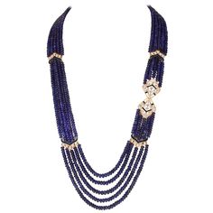 Smooth 1000 Ct Natural Tanzanite Bead Five Strand Necklace With Diamond 14 Karat Yellow Gold All natural beads , no color enhancement Opera Length Gold clasp is such that you can adjust the length of the necklace 5 layers of Natural Beads These are Smooth beads , have very much Luster and shine Beautiful color pretty blue No color enhancement , no dye, Natural Beads This 5-strand necklace has been meticulously crafted to allow 1000 Carats of Tanzanite beads to lay perfectly as shown. Approximate Luxury Beads, Gems, And Cabochons For Formal Occasions, Luxury Faceted Beaded Necklace For Formal Occasions, Luxury Formal Faceted Beaded Necklaces, Luxury Formal Faceted Beaded Necklace, Luxury Gemstone Beaded Necklaces For Formal Events, Luxury Formal Gemstone Beaded Necklaces, Luxury Polished Beads Necklace For Formal Occasions, Luxury Polished Beaded Necklaces For Formal Occasions, Luxury Formal Beaded Necklaces With Polished Beads