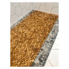 an area rug made out of wood and stone