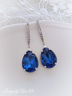 "Sapphire Blue Swarovski Crystal Silver Necklace Beautiful top quality Swarovski crystal earrings. Made with bright sapphire blue crystals, etched silver cups, dainty silver chain. Lightweight and very comfortable to wear. Pendant measures 1 x 1/2\" The chain is 18\", finished with 3\" extension chain and silver lobster clasp. SimplyChic pays big attention to the quality of all my designs. I attached a few pictures to show the unique and delicate frames used to showcase these beautiful Swarovski Blue Rhinestone Crystal Earrings For Wedding, Blue Crystal Earrings For Wedding, Sapphire Crystal Drop Earrings, Formal Blue Crystal Earrings, Formal Sapphire Crystal Earrings, Blue Sterling Silver Crystal Earrings For Formal Occasions, Blue Sterling Silver Crystal Earrings For Formal Events, Blue Dangle Crystal Earrings For Formal Occasions, Blue Sparkling Crystal Jewelry