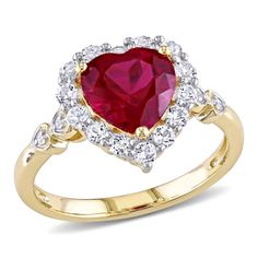 Show your love with this luxurious Created Ruby, White Topaz and Diamond-Accent Halo Engagement Ring. Mounted in gleaming yellow gold, this exquisite ring showcases a heart-cut, prong-set created ruby gemstone (8 x 8mm) as a centerpiece surrounded by a halo of 14 round-cut, prong-set white topaz gemstones. This ring is further accentuated by four round-cut, pave-set shining diamonds (G-H, I2-I3) resting along the scalloped band. Enhanced with a high polish finish, this classic gemstone and diamo Yellow Gold Halo Engagement Ring, Heart Halo Ring, Gold Halo Engagement Ring, Heart Halo, Round Diamond Setting, Gold Rings Fashion, Gold Halo, Topaz Gemstone