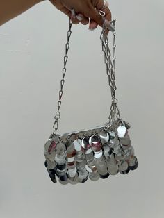 DETAILS:Stand out and shine with our silver sequin bag! Carefully crafted with a chain strap, this bag is perfect for adding a touch of glamour to any outfit. This bag is sure to make a statement and turn heads wherever you go! Silver Bag With Chain Strap For Night Out, Silver Bags With Chain Strap For Night Out, Glamorous Silver Shoulder Bag With Chain Strap, Silver Clutch Bag For Night Out, Silver Clutch For Night Out, Silver Clutch Evening Bag With Chain Strap, Silver Evening Bag With Chain Strap For Night Out, Silver Chain Bag For Night Out, Trendy Silver Evening Bag With Chain Strap