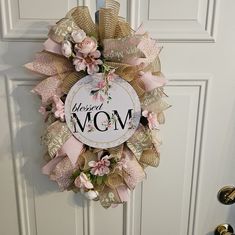 a wreath that says, you're the most wonderful mom on it hanging on a door