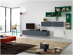 a living room filled with furniture and bookshelves next to a wall mounted tv