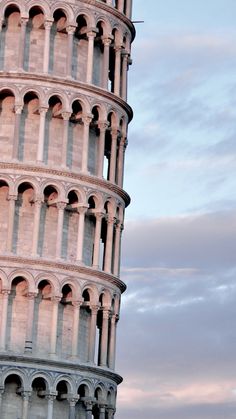 the leaning tower is very tall and has arches