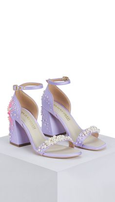 Wholly hand-embellished pair of heels, delicately laden with pearls, is handcrafted in a soft lilac satin. She’s embroidered, inspired by the concept of wishing upon a dandelion in pop colours and glass beads, that take to the wind and spread out as pearly puffballs. The D'orsay counter cups the ankle and she’s finished with an elegant open toe strap.Please note - As per the size of shoe, the dimension & heel size will also change. Color: Lilac No. pieces in a set: 2 Delivery Time: 4 weeks Engagement Sarees, Papa Don't Preach, Reception Sarees, Haldi Dress, The Dandelion, Celebrity Closet, A Dandelion, Bridal Jumpsuit, Bridal Bag