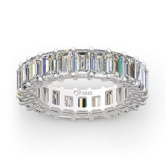 a white gold band with emerald cut diamonds