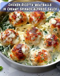 chicken ricotta meatballs with creamy spinach alfredo sauce in a pan on a table