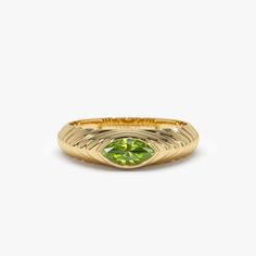 This 14k Gold step beveled ring features a sparkling 7x3.5 MM marquise cut peridot, the birthstone for August. The ring has a modern design, perfect for everyday wear, and the peridot gemstone adds a pop of color to the piece. The step-beveled design adds depth to the ring and the 14k Gold gives it a touch of luxury. This ring is perfect for anyone born in August or who loves the color green. Features: * Made to Order * Gold Kt: 14K Solid Gold (also available in 18K) * Available Gold Colors: Rose Gold, Yellow Gold, White Gold * Marquise Peridot: 1 pc 7 x 3.5 MM * Peridot Carat Weight: 0.43 ctw * Ready to Ship in 7-10 Business days  ▶ See more of our Gemstone Jewelry here- https://etsy.me/3CGRdMI ▶ See our storefront here - http://etsy.me/2lUcVnH  ▶ All store sections here * Diamond Rings - Fine Jewelry Marquise May Birthstone Ring, Marquise Yellow Gold Diamond Ring For May Birthstone, Green Marquise Birthstone Ring, Classic Green Marquise Rings, Green Marquise Cut Gemstone Ring, Green Marquise Ring In 14k Gold, Heirloom Green Marquise Rings, Marquise Green Ring In 14k Gold, Heirloom Green Marquise Cut Rings