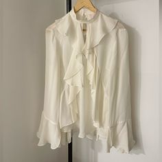 Cinq A Sept Nwt Ruffled Ivory Blouse Bought In Nyc. Never Worn, Great Condition Other Than Minor Snag In The Back Ruffle Pictured. Elegant White Top With Ruffle Hem, Elegant White Tops With Ruffle Hem, White Ruffled Blouse For Office, Elegant Ruffle Hem Tops For Work, Elegant Blouse With Ruffled Collar And Ruffle Hem, Elegant White Ruffled Tops, Feminine Ruffled Office Blouse, White Flowy Blouse With Ruffle Sleeves, Feminine Ruffled Blouse For Workwear