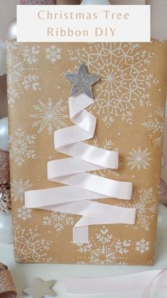 a christmas tree ribbon diy on top of a gift bag