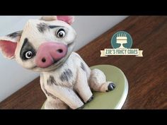 a close up of a toy pig on a table