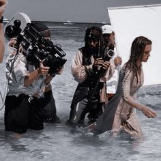 some people are in the water with cameras