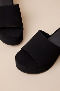 Looking for a go-to shoe for the upcoming season? Then look no further, because the Lulus Belamie Black Suede Platform Slide Sandals will quickly become your fave pair! Super soft faux suede shapes these trendy mules that have an almond-shaped toe bed (atop a 1.25"" toe platform) and a wide vamp strap that creates a peep-toe upper. A chunky block heel lends a comfortable finish to the simple and chic slide-on design! 3" wrapped block heel. Lightly cushioned insole. Rubber sole has nonskid markin Summer Suede Open Toe Platform Slippers, Summer Open Toe Suede Platform Slippers, Suede Sandals With Stacked Heel Slip-on, Suede Sandals With Stacked Heel In Slip-on Style, Suede Platform Slip-on Sandals, Suede Sandals With Stacked Heel And Slip-on Design, Slip-on Suede Sandals With Stacked Heel, Platform Slip-on Suede Sandals, Slip-on Suede Platform Sandals