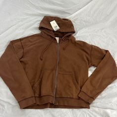 Urban Outfitters Bdg Bonfire Full Zip Hoodie Sweatshirt Size Medium Condition: Nwt Color: Brown Details : - Bdg Bonfire Zip-Up Hoodie In A Classic Fit That's Perfect For Layering. - Lightweight Hoodie With A Garment-Washed Finish For A Lived-In Vintage Look And Feel. - Classic Fit Lightweight Hoodie - Kanga Pockets - Unisex Extra: - I Ship Between 1-2 Days Basic Fall Hoodie With Pockets, Everyday Hooded Tops With Ribbed Cuffs, Fall Sweats With Double-lined Hood, Urban Hooded Top For Loungewear, Cozy Fit Everyday Hooded Tops, Casual Brown Sweatshirt For Everyday, Urban Outfitters Hooded Hoodie With Drawstring, Urban Outfitters Cotton Sweatshirt For Streetwear, Hooded Top With Pockets For Everyday