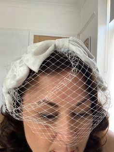 This was inspired by an original head piece I saw at a 1940s weekender. I thought it would make a beautiful adornment for a bride.  It is made of Ivory velvet on a wired base and it is secured by three small combs. one in the middle and one behind each ear. it has a small birdcage veil. It is very light a comfortable to wear and adds a retro , stylish look to any bridal outfit. These measures 18cm by 11cm. I can making this in other colours. If you would like one in a certain colour please get in touch. Please be aware that colours may differ depending on your browser and sizes are approximate Vintage White Costume Hats For Wedding, Vintage White Costume Hats And Headpieces For Wedding, White Vintage Fascinator For Royal Ascot, Vintage White Wedding Costume Hats And Headpieces, Vintage White Hat Headpiece, Vintage White Formal Headpieces, White Vintage Wedding Costume Hats And Headpieces, White Vintage Headpiece For Formal Occasions, White Vintage Headpieces For Formal Occasions