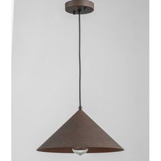 a light hanging from the ceiling with a white wall behind it and a brown shade