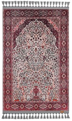 an intricately decorated rug with fringes and tassels on the edges,