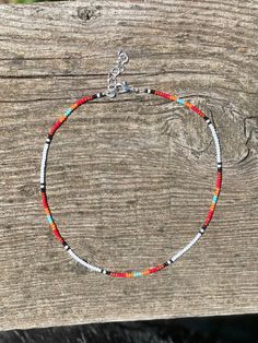 Beaded string choker in bright colors. Charm options available. Aztec Clay, Southern Jewelry, Bracelet Stuff, Tiny Bead Bracelet, Diy Bracelets With String, Ankle Bracelets Diy, Indian Designs, Bracelets Ideas, Beaded Necklace Patterns