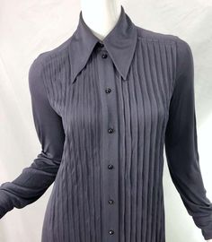 For Sale on 1stDibs - MARC JACOBS for BERGDORF GOODMAN early 2000s 1920s flapper style grey shirt dress ! Features a pleated bodice with a drop waist. Buttons up the front and Fitted Classic Pleated Tops, Fitted Pintuck Tops For Workwear, Gray Fitted Formal Tops, Gray Fitted Top For Formal Occasions, Classic Collared Pleated Top, Classic Pleated Collared Tops, Classic Fitted Tops With Pintucks, Fitted Long Sleeve Pintuck Top, Fitted Long Sleeve Top With Pintucks