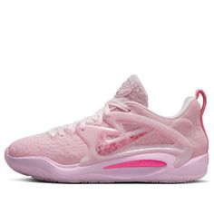 a women's nike basketball shoe in pink and white