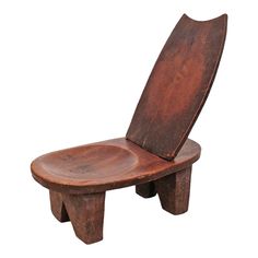 a wooden chair that is shaped like a boat