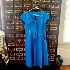 Vintage Style Midi Dress From Frock Shop Of Houston. New With Tags. Size Large Retro Blue Cotton Dresses, Blue Retro Cotton Dresses, Blue Cotton Knee-length Vintage Dress, Blue Knee-length Cotton Vintage Dress, Casual Blue Vintage Dress With Short Sleeves, Blue Retro Dress With Short Sleeves, Blue Retro Short Sleeve Dress, Retro Blue Dress With Short Sleeves, Style Midi Dress