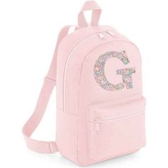 LIBERTY OF LONDON MINI PERSONALISED CHILDREN'S BACKPACK IN PINK A very handy little backpack - perfect for nursery, school, after school activities and weekends away. Featuring 2 zipped pockets and handle for carrying or hanging. Made from 100% polyester. The bag measures 35 x 23 x 12 cm with a capacity of 7 litres. Choose from any of The fabulous Liberty fabrics. Item can be cleaned by wiping with a damp cloth. | My Little Shop UK | Liberty Of London Personalised Mini Backpack, Pink | Maisonette collects the best children’s products from around the world (unlike Zulily, Etsy, The Tot, Farfetch Kids, Childrensalon, Crate and Kids, Kohls, Wayfair, Buy Buy Baby, Nordstroms, Mini Boden, J.Crew Factory, or PotteryBarn Kids), creating a curated shopping experience for you. Think of us as your s Cute Pink Backpack For School Events, Cute Pink Backpack For Back To School, Cute Pink School Backpack, Pink Backpack For School Events, Pink Backpack For Back To School, Cute Pink Bags For School Events, Pink Backpack For End Of School Year Events, After School Activities, Liberty Fabrics